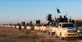 FILE - This file image posted on a militant website on Tuesday, Jan. 7, 2014, which is consistent with AP reporting, shows a convoy of vehicles and fighters from the al-Qaida-linked Islamic State of Iraq and the Levant (ISIL) fighters in Iraq's Anbar Province. The Islamic State was originally al-Qaida's branch in Iraq, but it used Syria's civil war to vault into something more powerful. It defied orders from al-Qaida's central command and expanded its operations into Syria, ostensibly to fight to topple Assad. But it has turned mainly to conquering territory for itself, often battling other rebels who stand in the way. (AP Photo/militant website, File)